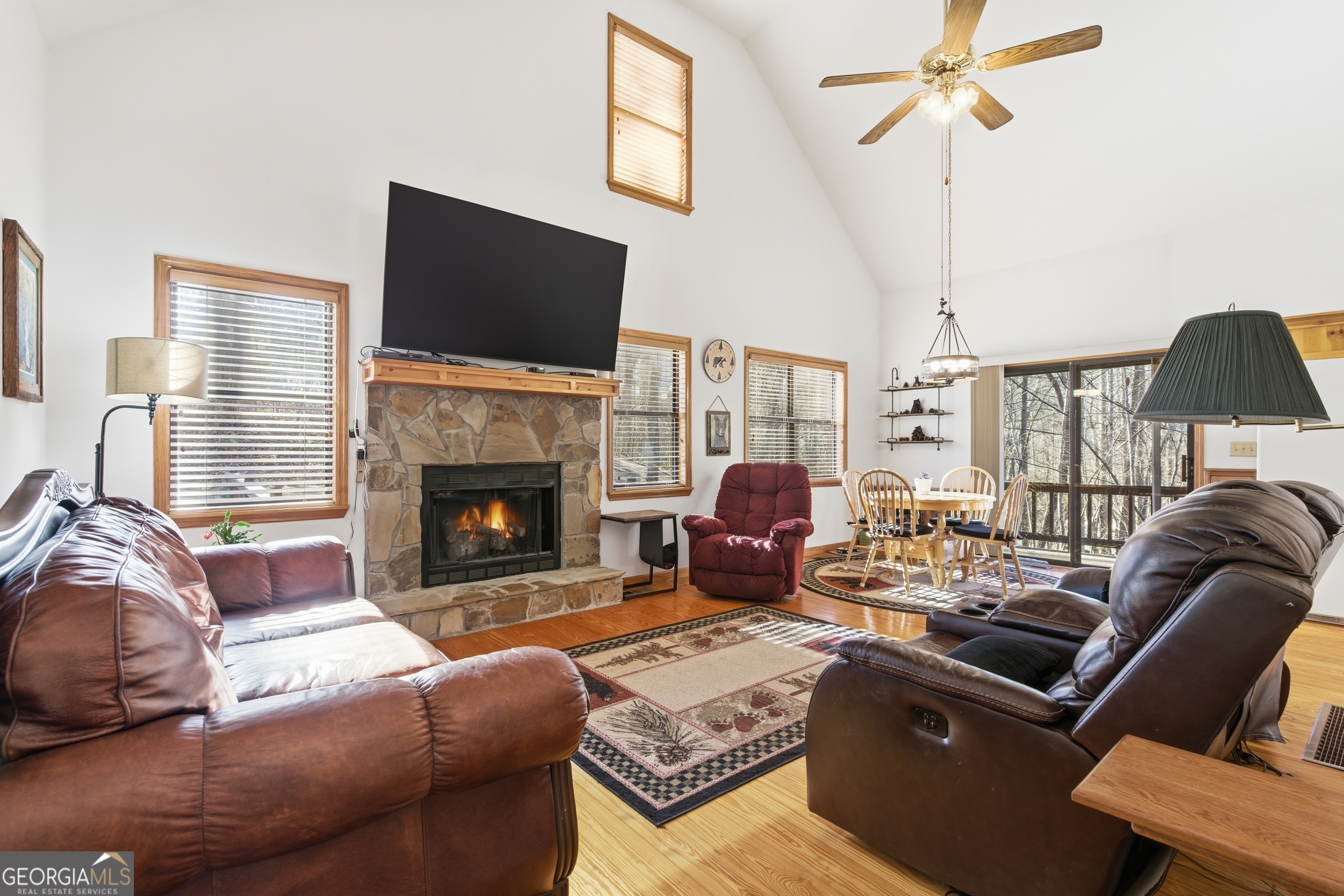 1637 Townsend Mill Road Young Harris, GA 30582 - Photo 10 of 57 a living room with furniture fireplace and flat screen tv
