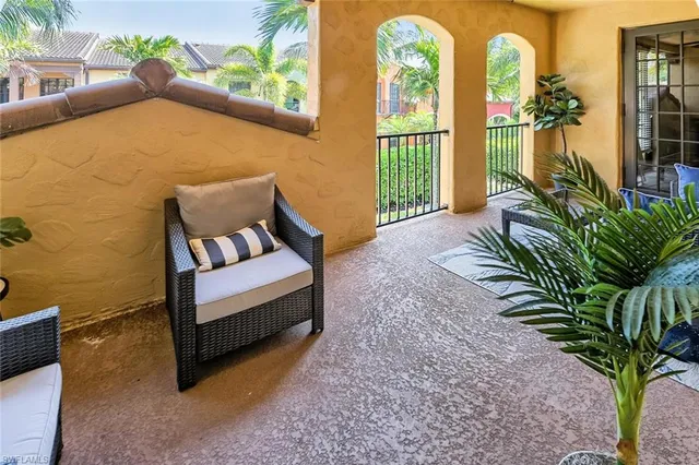 a balcony with couple of flower plants