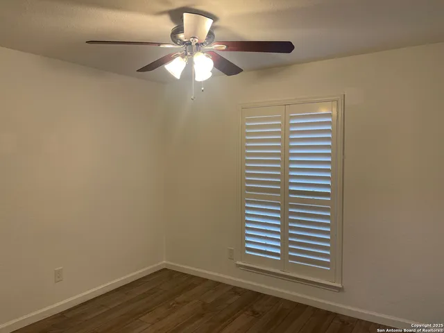 a view of a room that has a window in it