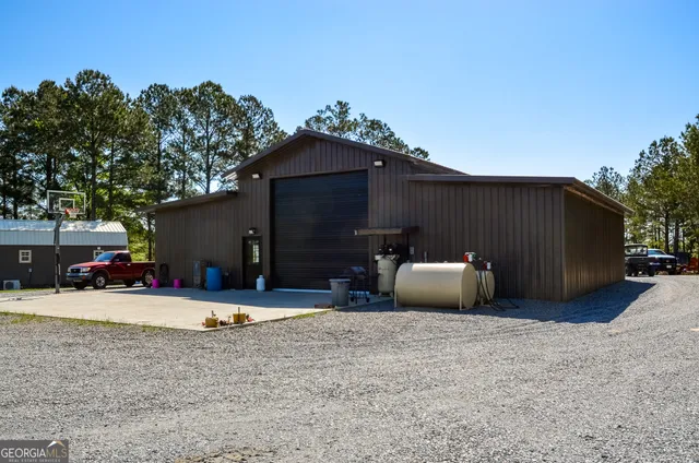 a view of a chair and tables in patio