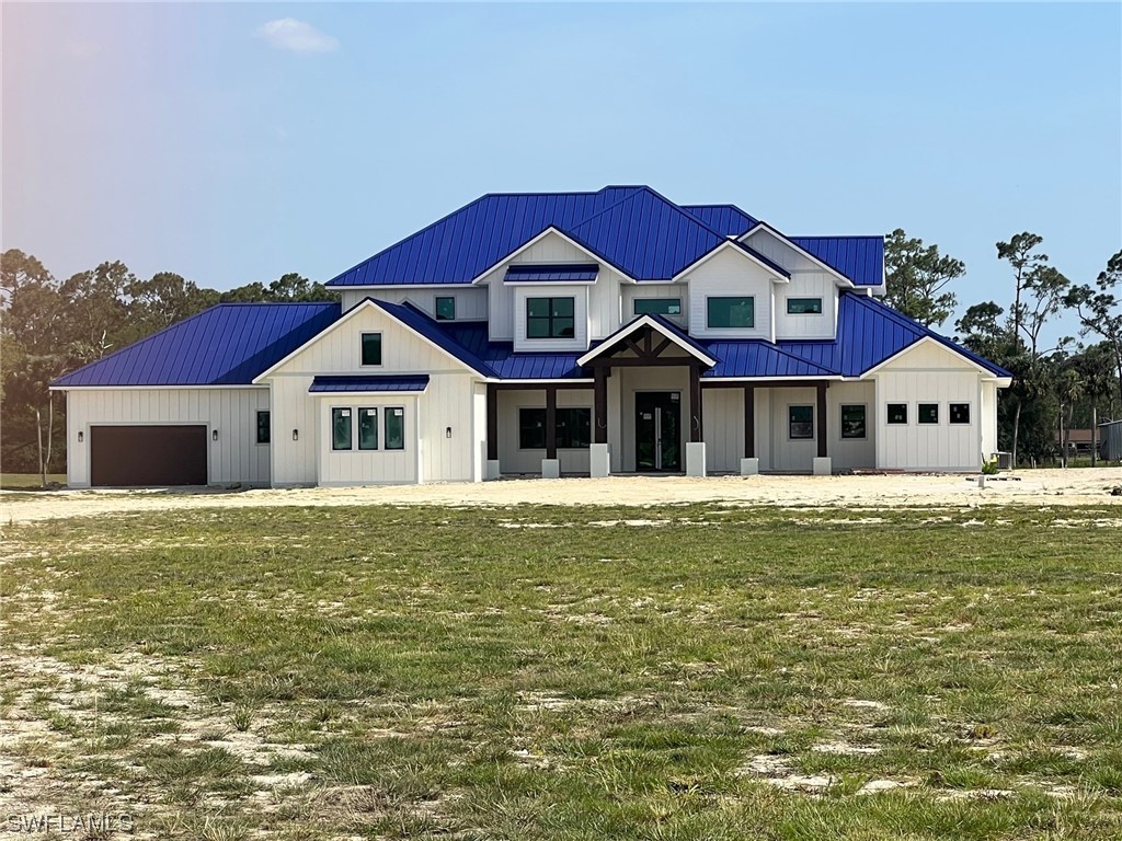 14970 Cemetery Road Fort Myers, FL 33905 - Photo 1 of 4 a front view of a house with a yard