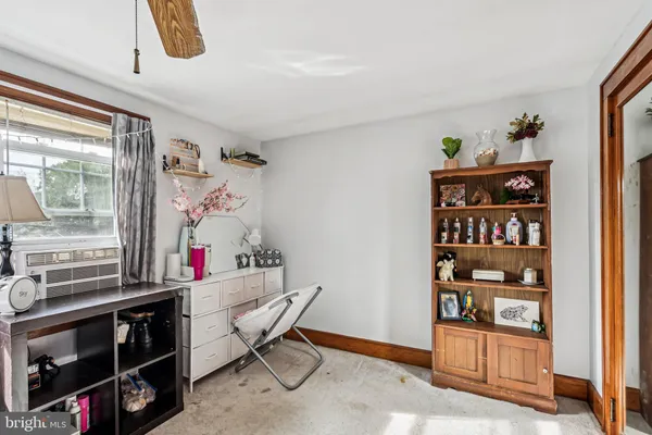 a view of a workspace with furniture