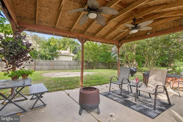 a view of yard with patio