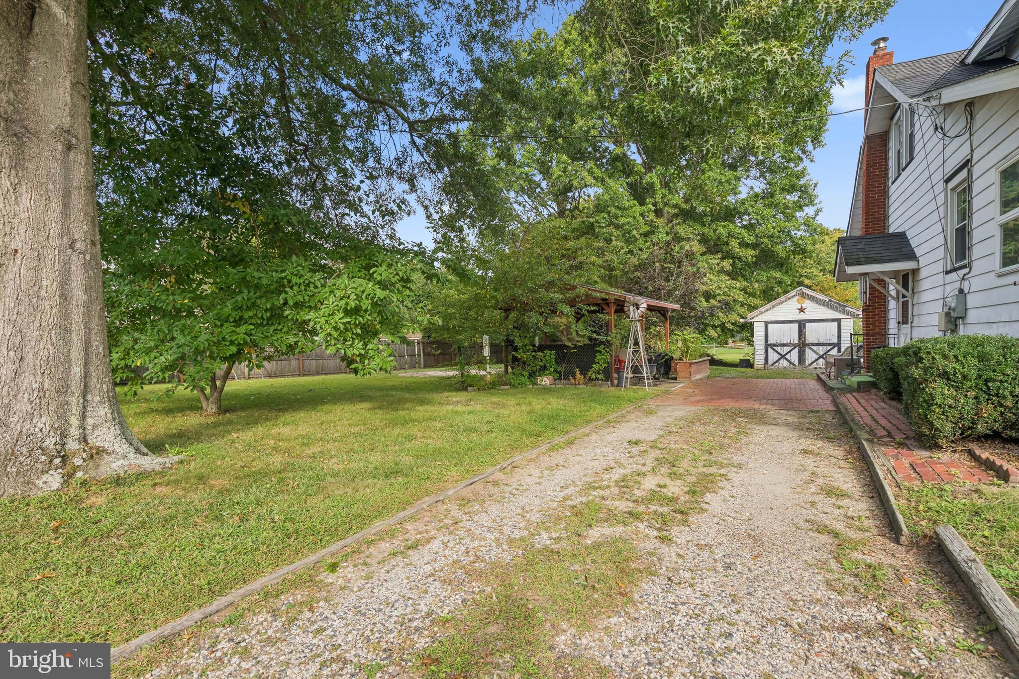19 Sickler Street Quinton, NJ 08079 - Photo 3 of 25 a view of a backyard with a garden
