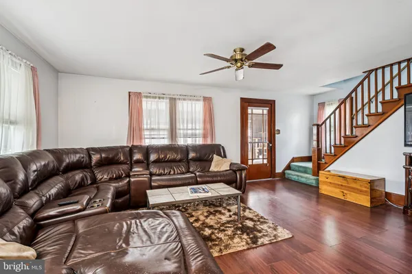 a living room with furniture or wooden floor and a window