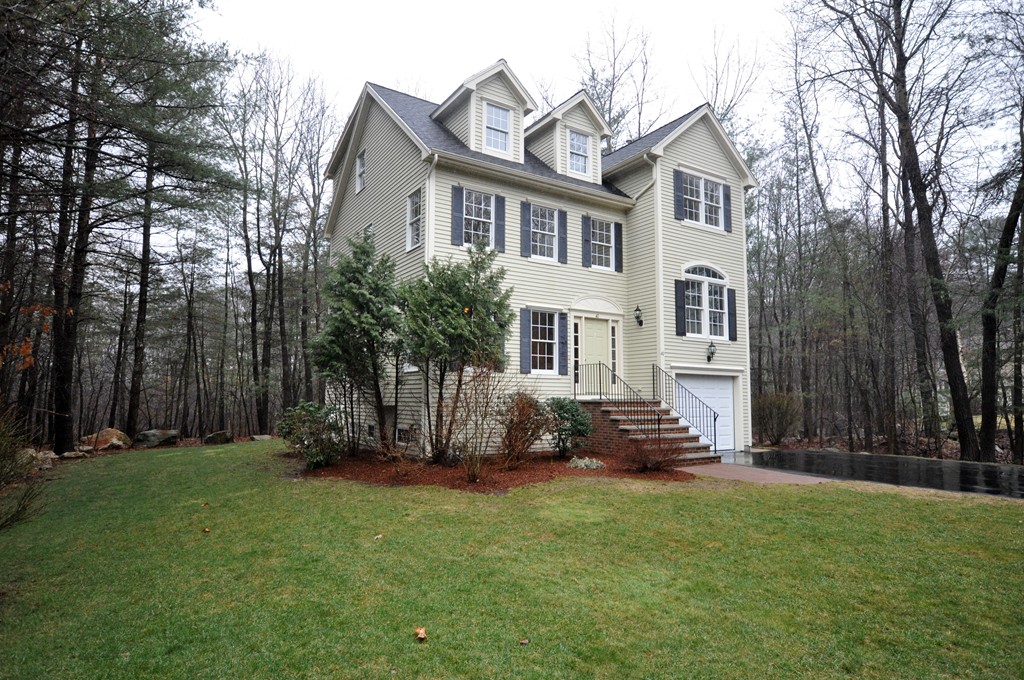40 Battle Flagg Road Bedford, MA 01730 - Photo 1 of 30 a front view of a house with a yard