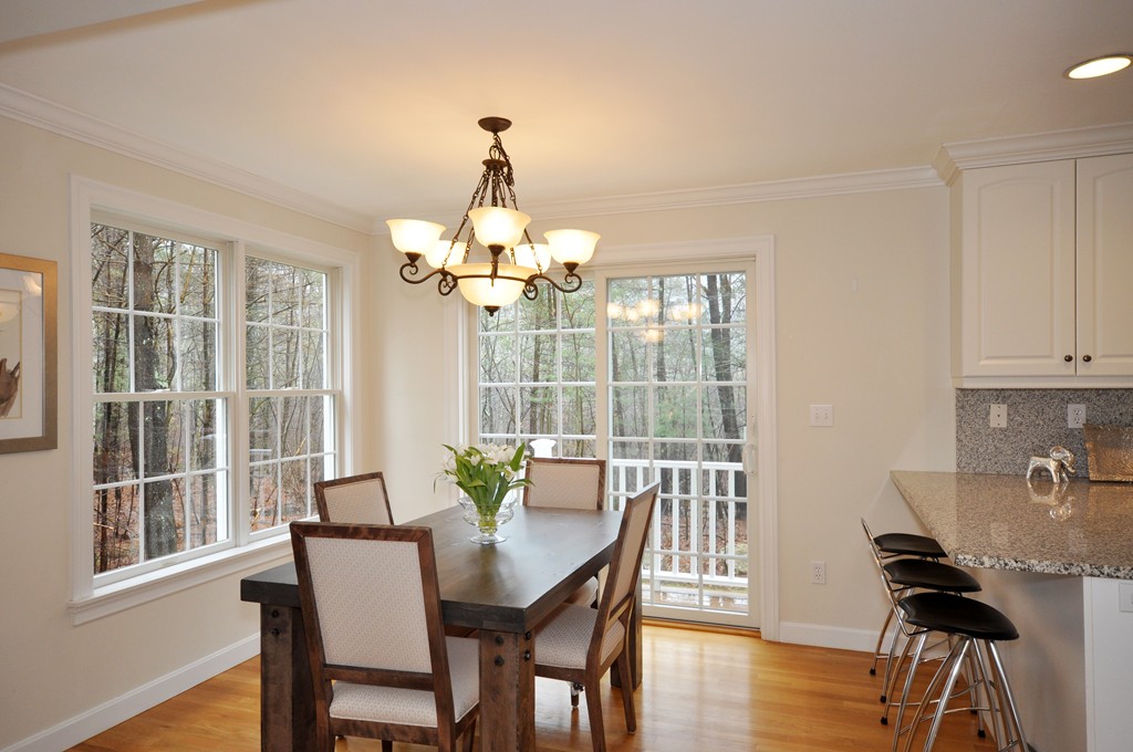 40 Battle Flagg Road Bedford, MA 01730 - Photo 11 of 30 a view of a dining room with furniture window and wooden floor