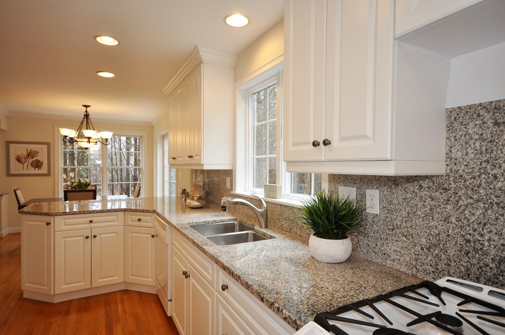 40 Battle Flagg Road Bedford, MA 01730 - Photo 15 of 30 a kitchen with a sink and cabinets
