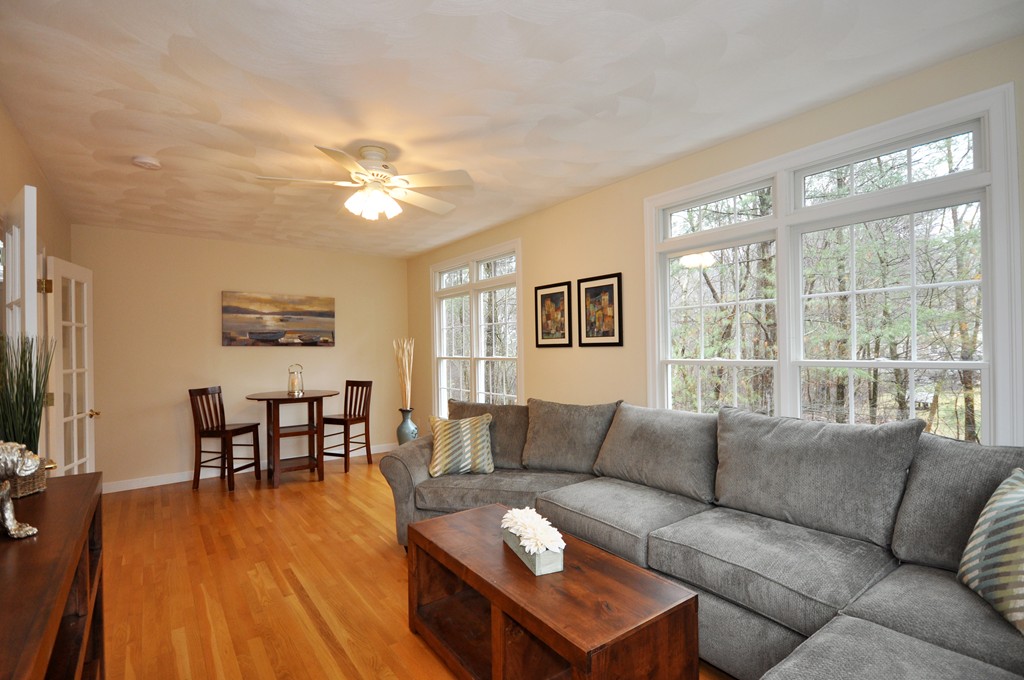 40 Battle Flagg Road Bedford, MA 01730 - Photo 23 of 30 a living room with furniture and a wooden floor