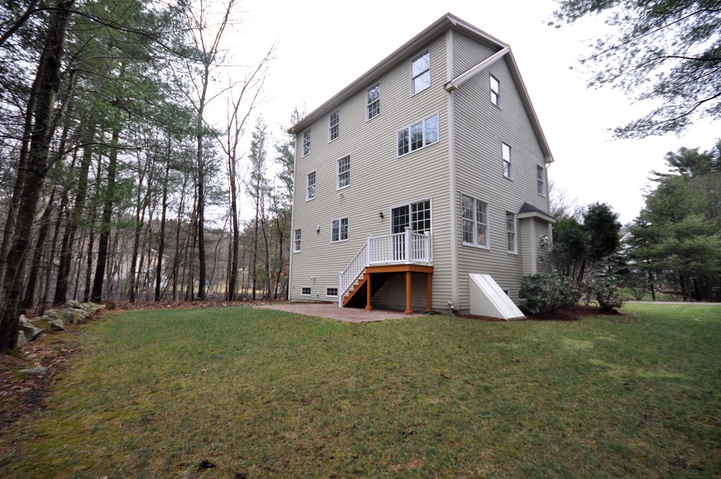 40 Battle Flagg Road Bedford, MA 01730 - Photo 29 of 30 a view of house with backyard and trees