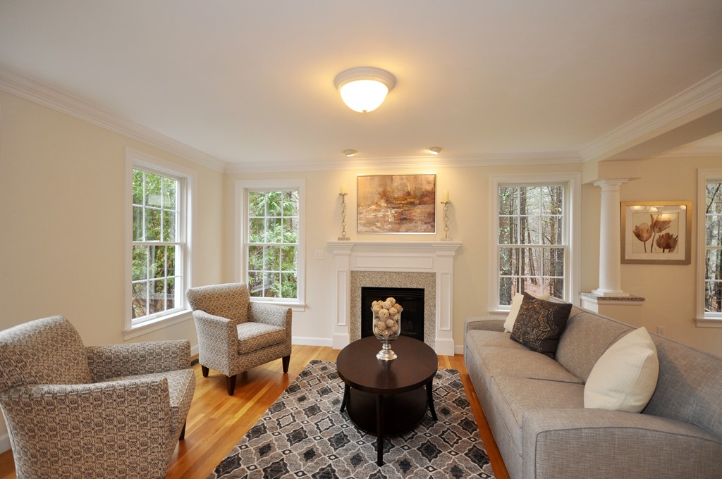 40 Battle Flagg Road Bedford, MA 01730 - Photo 4 of 30 a living room with furniture and a fireplace