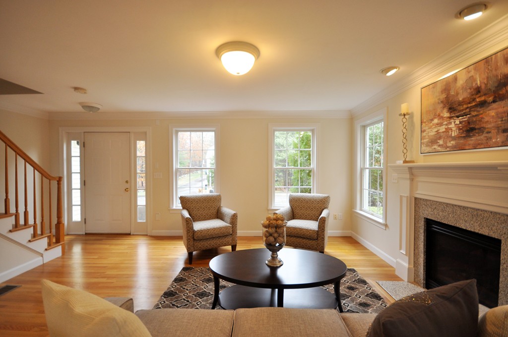 40 Battle Flagg Road Bedford, MA 01730 - Photo 6 of 30 a living room with fireplace furniture and a large window