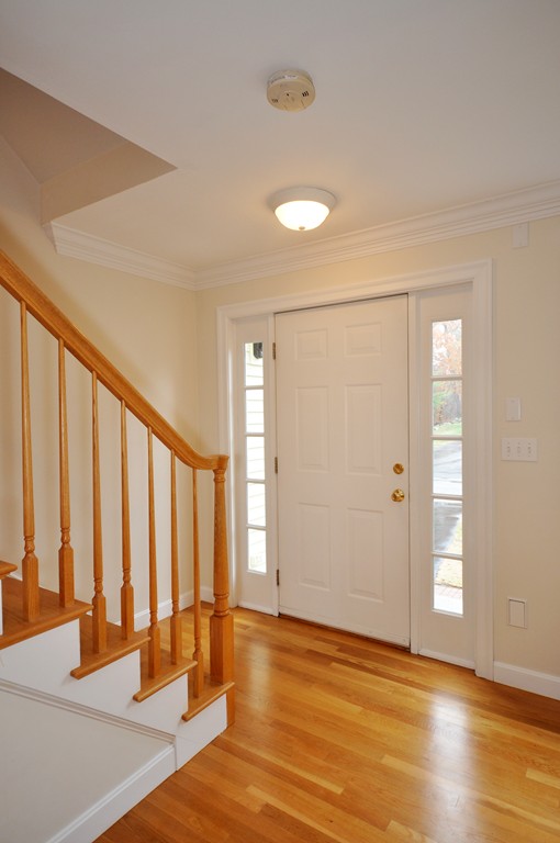 40 Battle Flagg Road Bedford, MA 01730 - Photo 10 of 30 a view of an empty room with wooden floor and a window