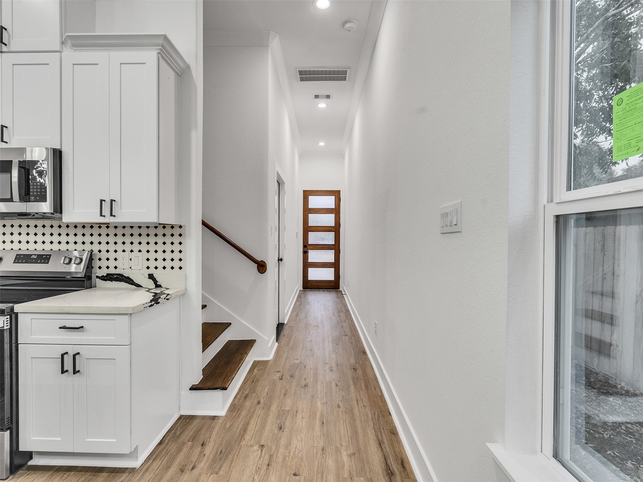 6014 Grace Lane, Unit A/B Houston, TX 77021 - Photo 12 of 36 a view of a hallway with wooden floor and staircase