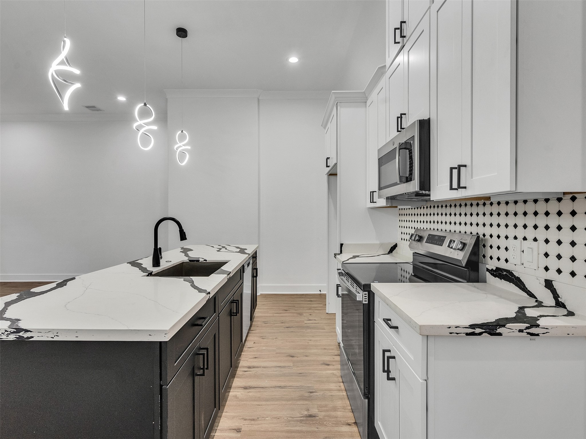 6014 Grace Lane, Unit A/B Houston, TX 77021 - Photo 28 of 36 a kitchen with a sink stove and cabinets