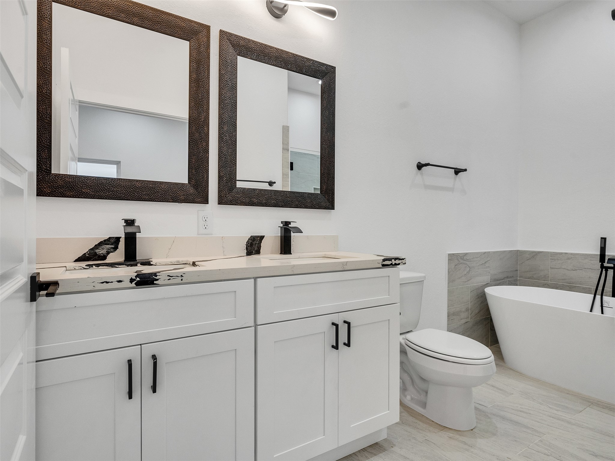 6014 Grace Lane, Unit A/B Houston, TX 77021 - Photo 32 of 36 a bathroom with a toilet sink and mirror