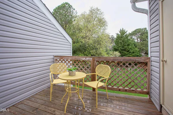 a wooden bench sitting in a roof deck