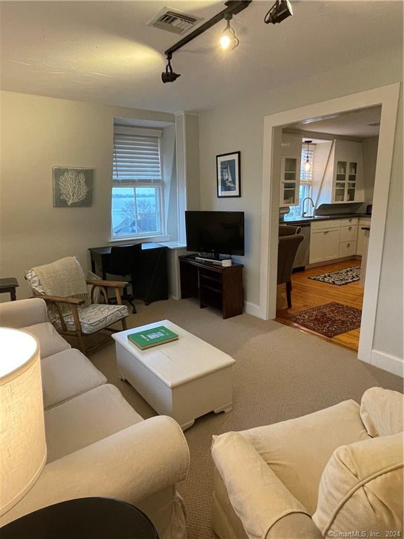 51 Front Street Groton, CT 06340 - Photo 12 of 21 a living room with furniture and a flat screen tv