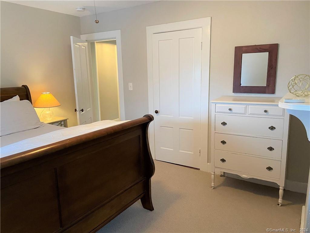 51 Front Street Groton, CT 06340 - Photo 18 of 21 a bedroom with a bed and a dresser