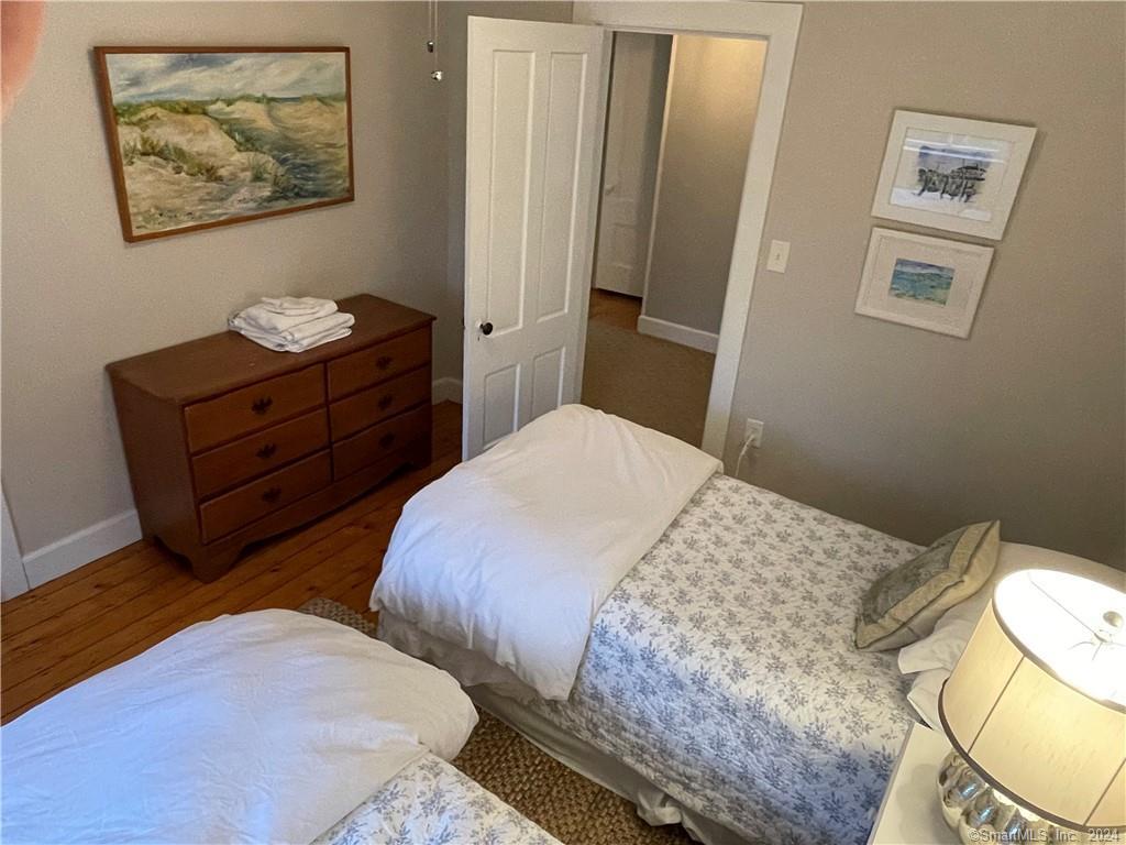 51 Front Street Groton, CT 06340 - Photo 20 of 21 a bedroom with a bed and the view of bathroom