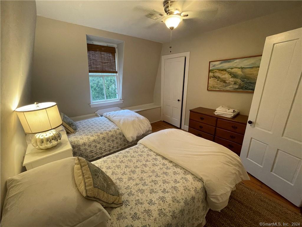 51 Front Street Groton, CT 06340 - Photo 21 of 21 a bedroom with two beds and painting on the wall