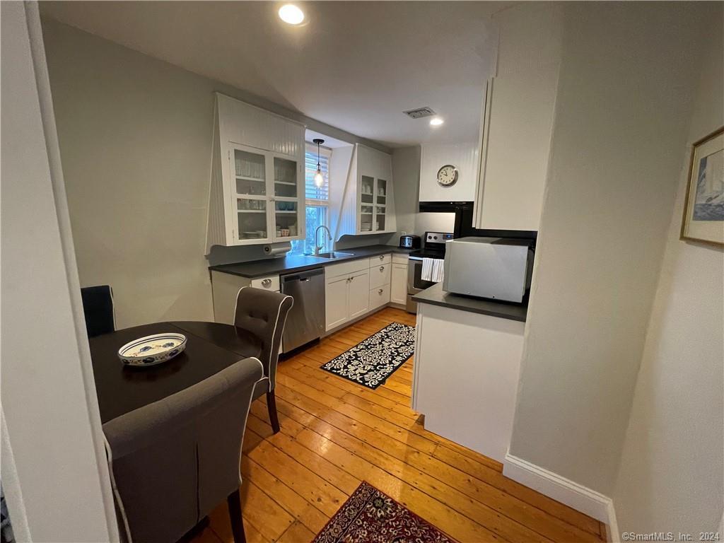 51 Front Street Groton, CT 06340 - Photo 6 of 21 a living room with furniture and a window