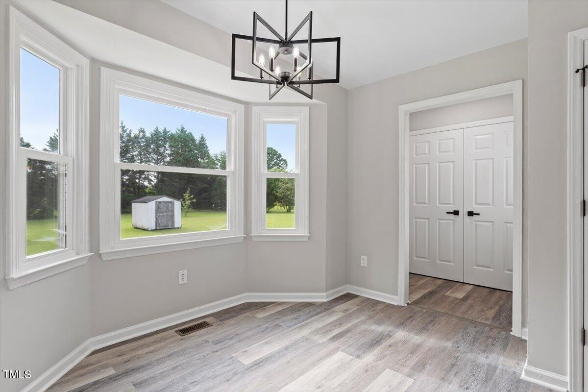 1480 White Memorial Church Road Willow Spring, NC 27592 - Photo 13 of 23 a view of an empty room with a window