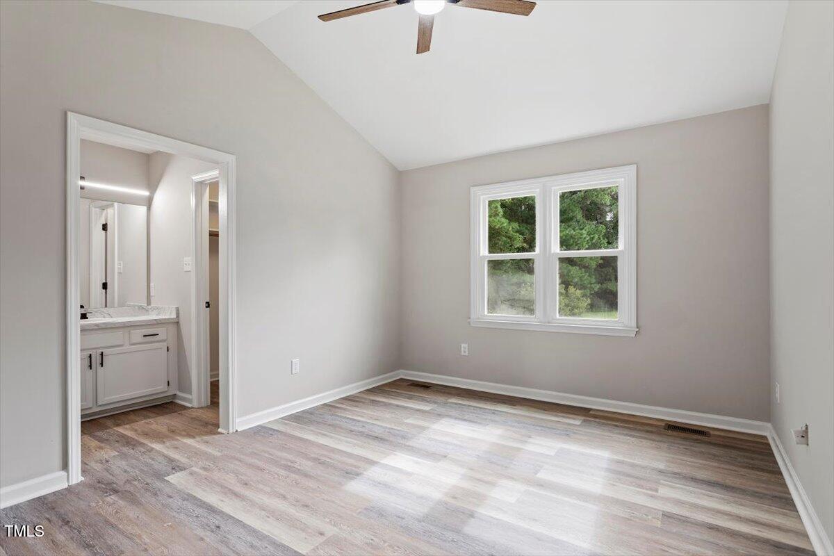 1480 White Memorial Church Road Willow Spring, NC 27592 - Photo 15 of 23 wooden floor in an empty room with a window