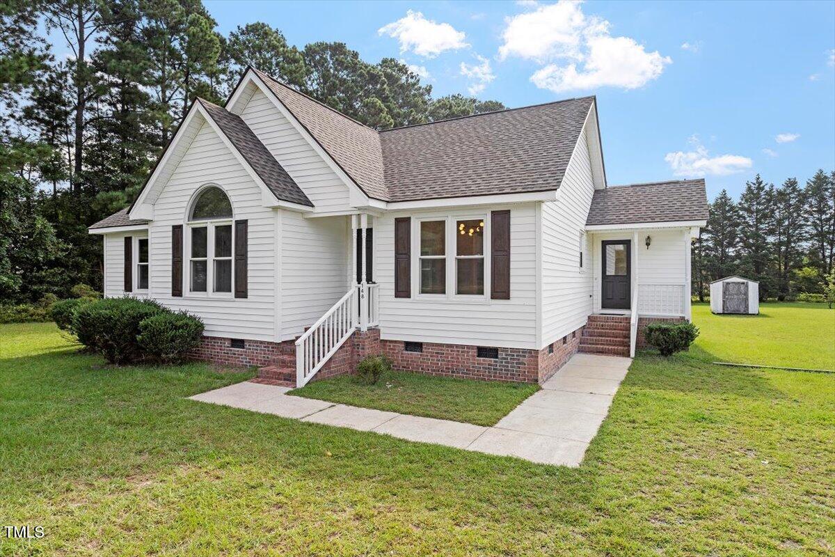 1480 White Memorial Church Road Willow Spring, NC 27592 - Photo 2 of 23 a front view of a house with yard and green space