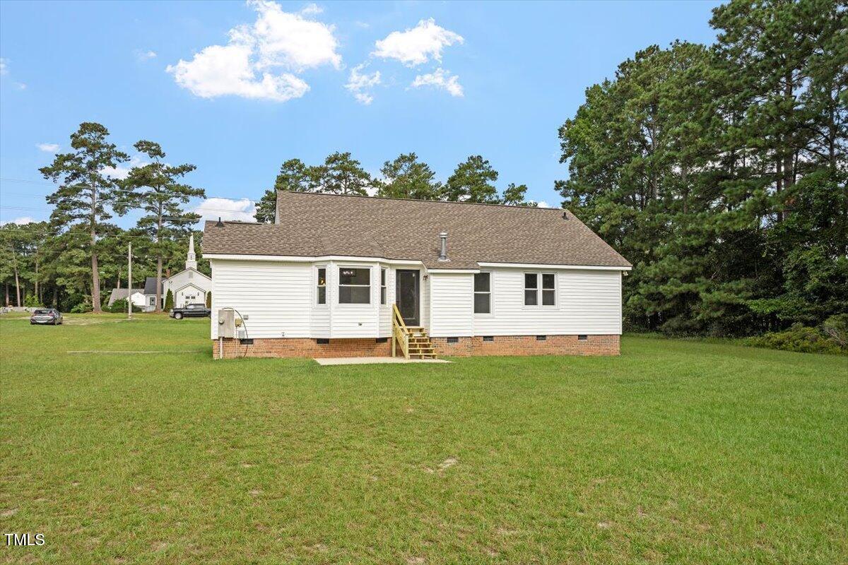 1480 White Memorial Church Road Willow Spring, NC 27592 - Photo 21 of 23 a view of a house with a yard