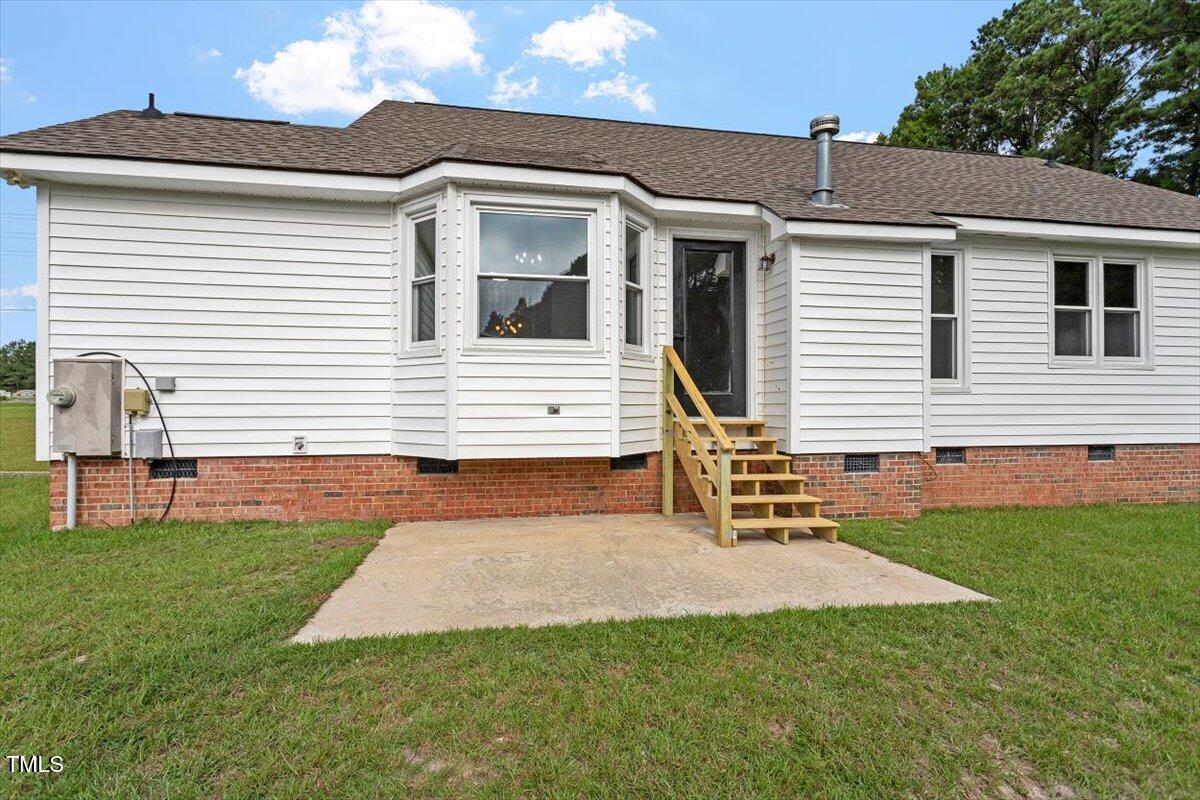 1480 White Memorial Church Road Willow Spring, NC 27592 - Photo 22 of 23 a view of a house with a yard