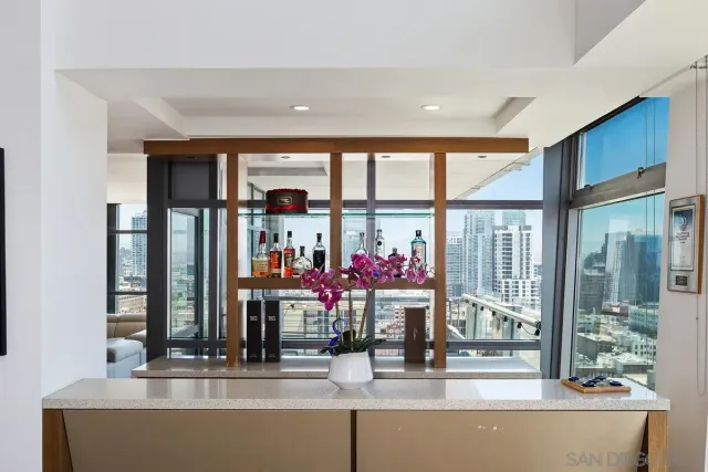 a dining room with furniture and window