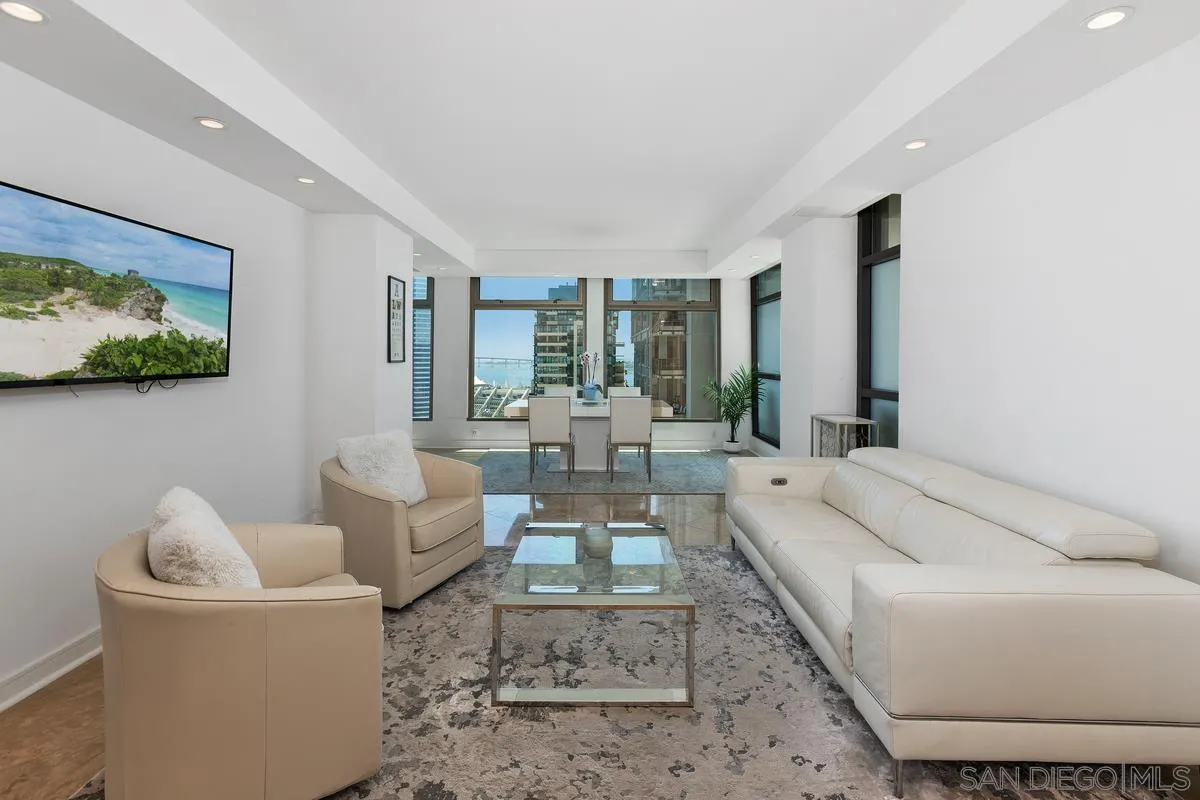 645 Front Street, Unit 2004 San Diego, CA 92101 - Photo 18 of 47 a living room with furniture and a flat screen tv