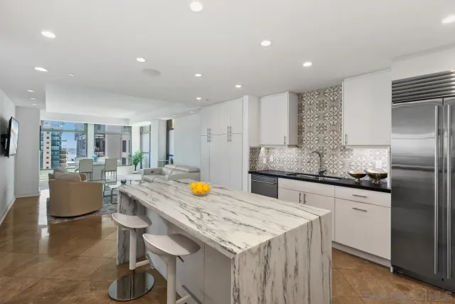 a large bedroom with a bed and a fireplace