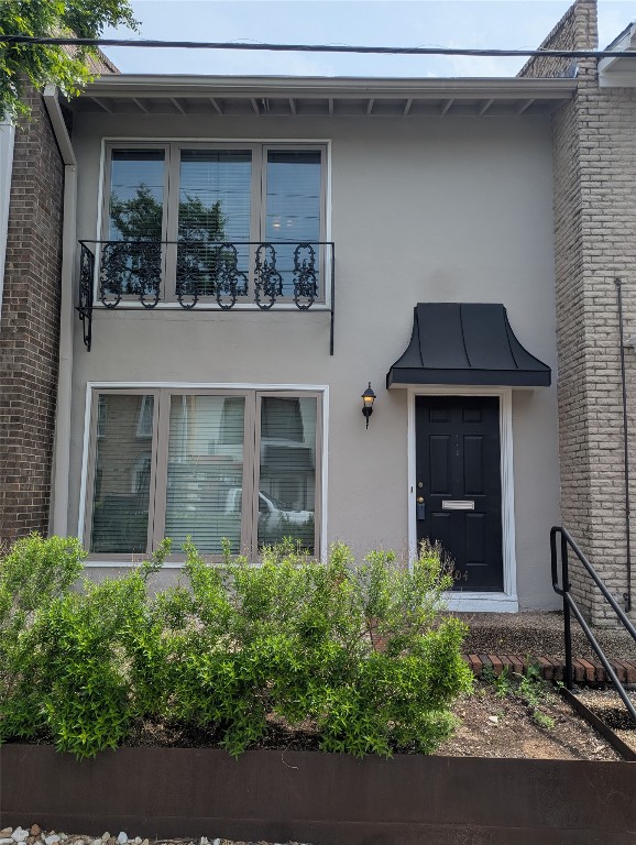 2316 Enfield Road, Unit 104 Austin, TX 78703 - Photo 1 of 1 a front view of a house with garden