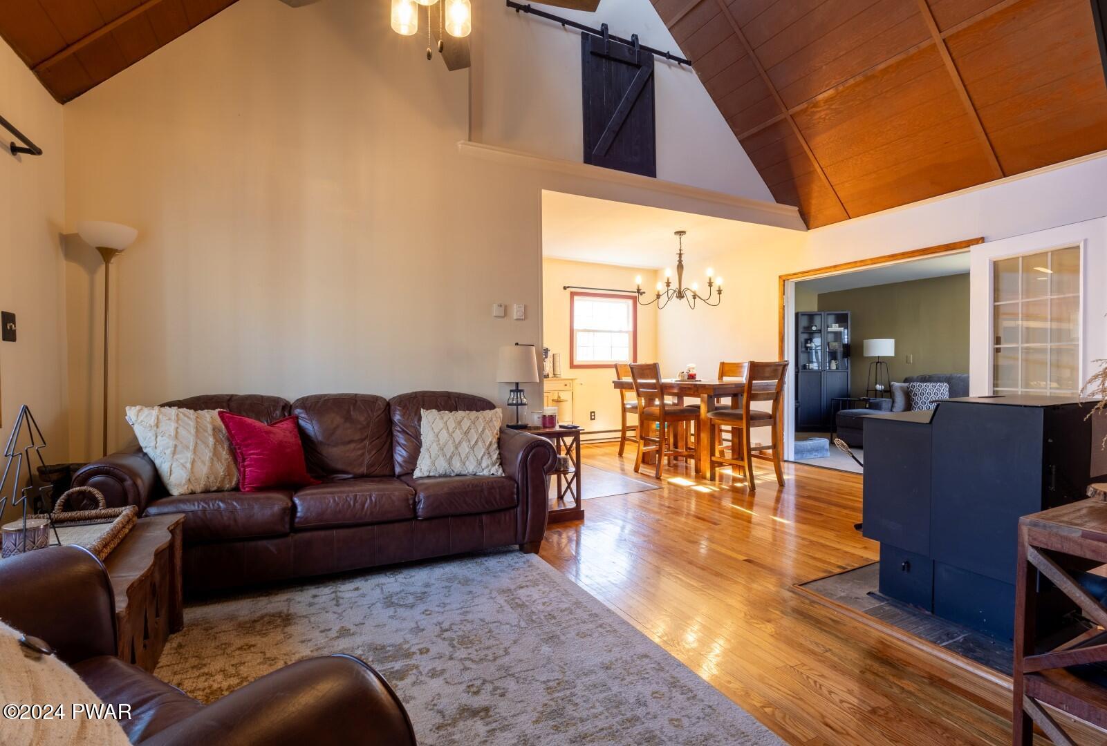 137 Stonehenge Road Milford, PA 18337 - Photo 5 of 30 a living room with furniture and a wooden floor