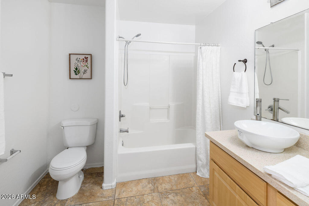 1287 North Alma School Road, Unit 123 Chandler, AZ 85224 - Photo 11 of 26 a bathroom with a granite countertop sink toilet and shower