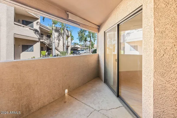 a view of a white building with large windows