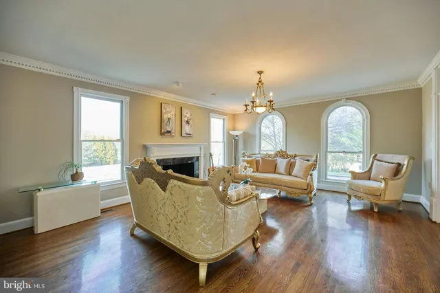a view of a dining room with furniture wooden floor and chandelier