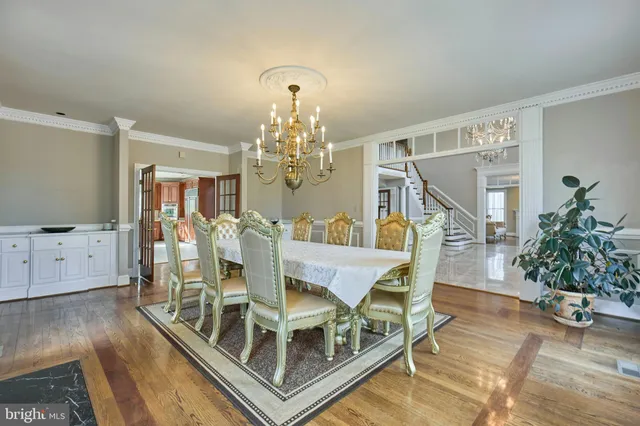 a living room with furniture fireplace and wooden floor