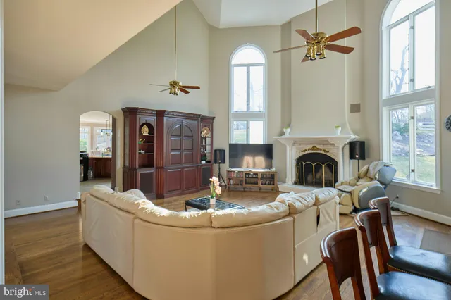 a bedroom with a large bed and a flat tv screen on dresser