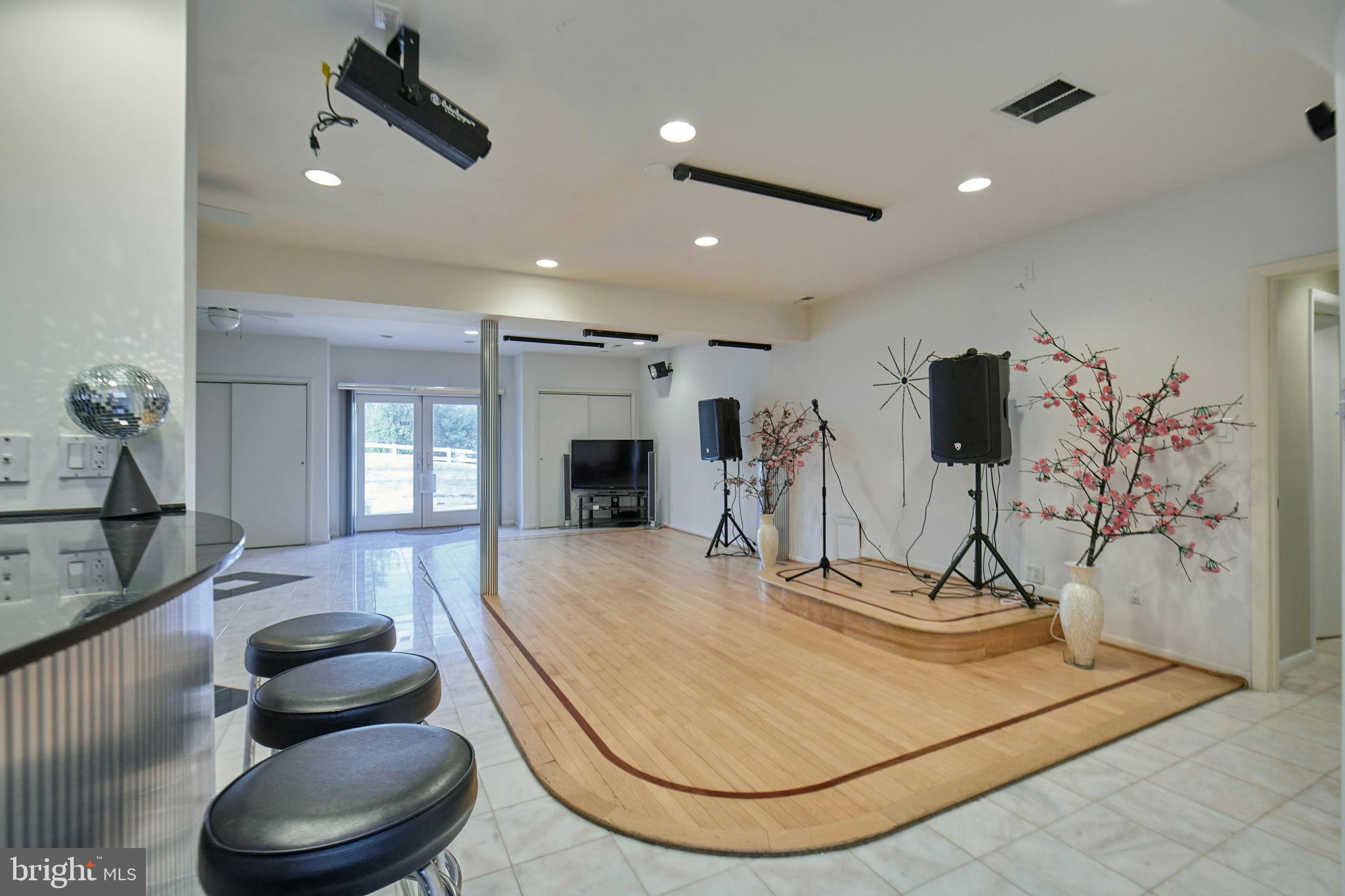 6830 Clifton Road Clifton, VA 20124 - Photo 46 of 85 Dance floor with walk out to the yard and patio