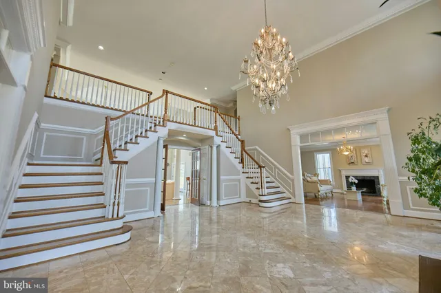 a view of a dining room with furniture wooden floor and chandelier