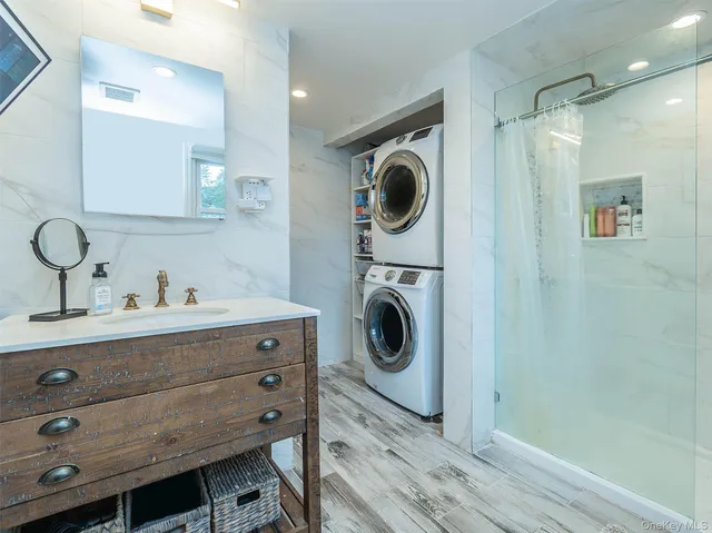 a view of a hallway with washer and dryer