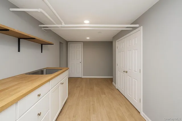 a hallway with cabinets