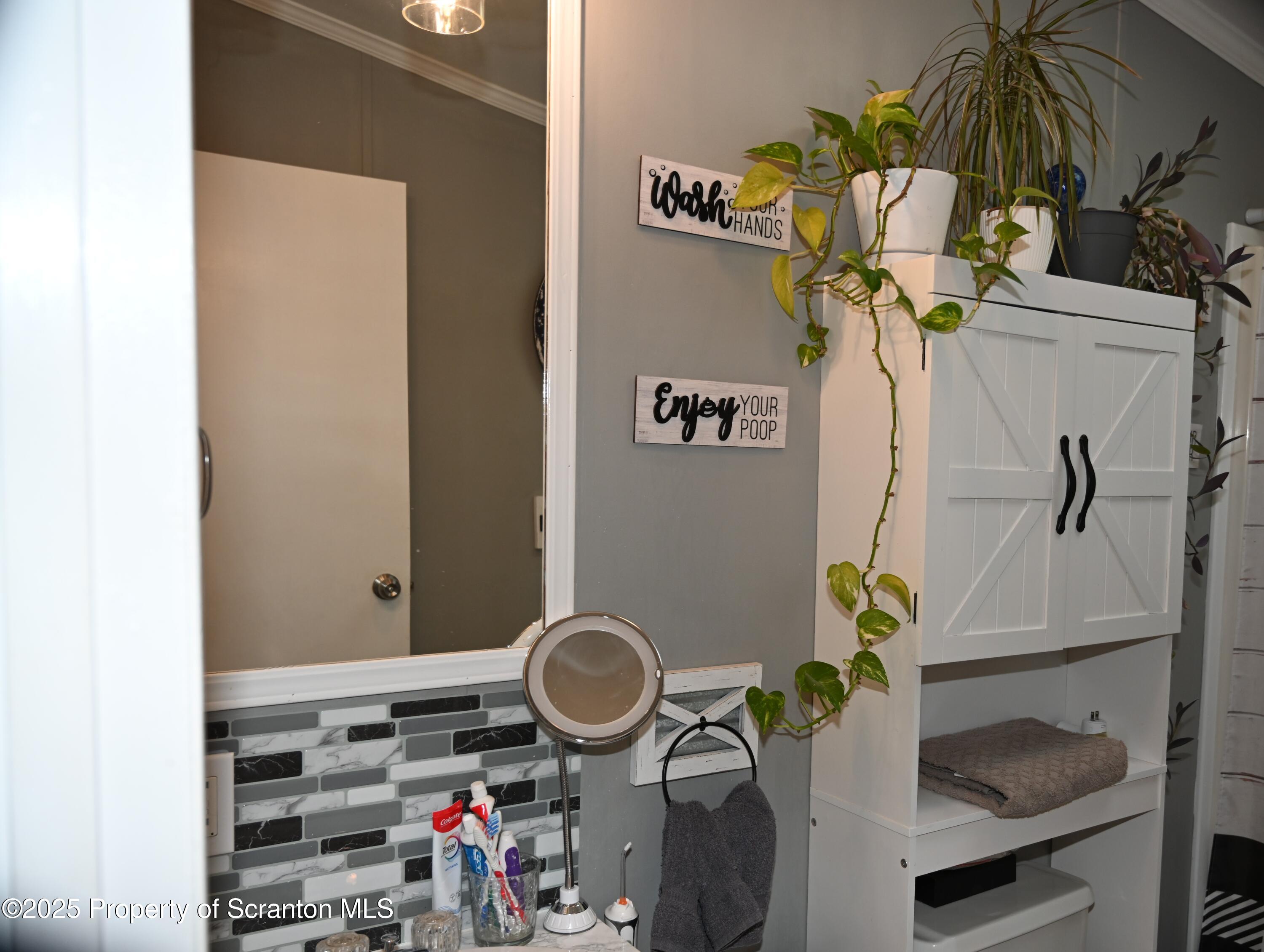 68 Spring Street Great Bend, PA 18821 - Photo 11 of 32 a table with a vase and flowers on it