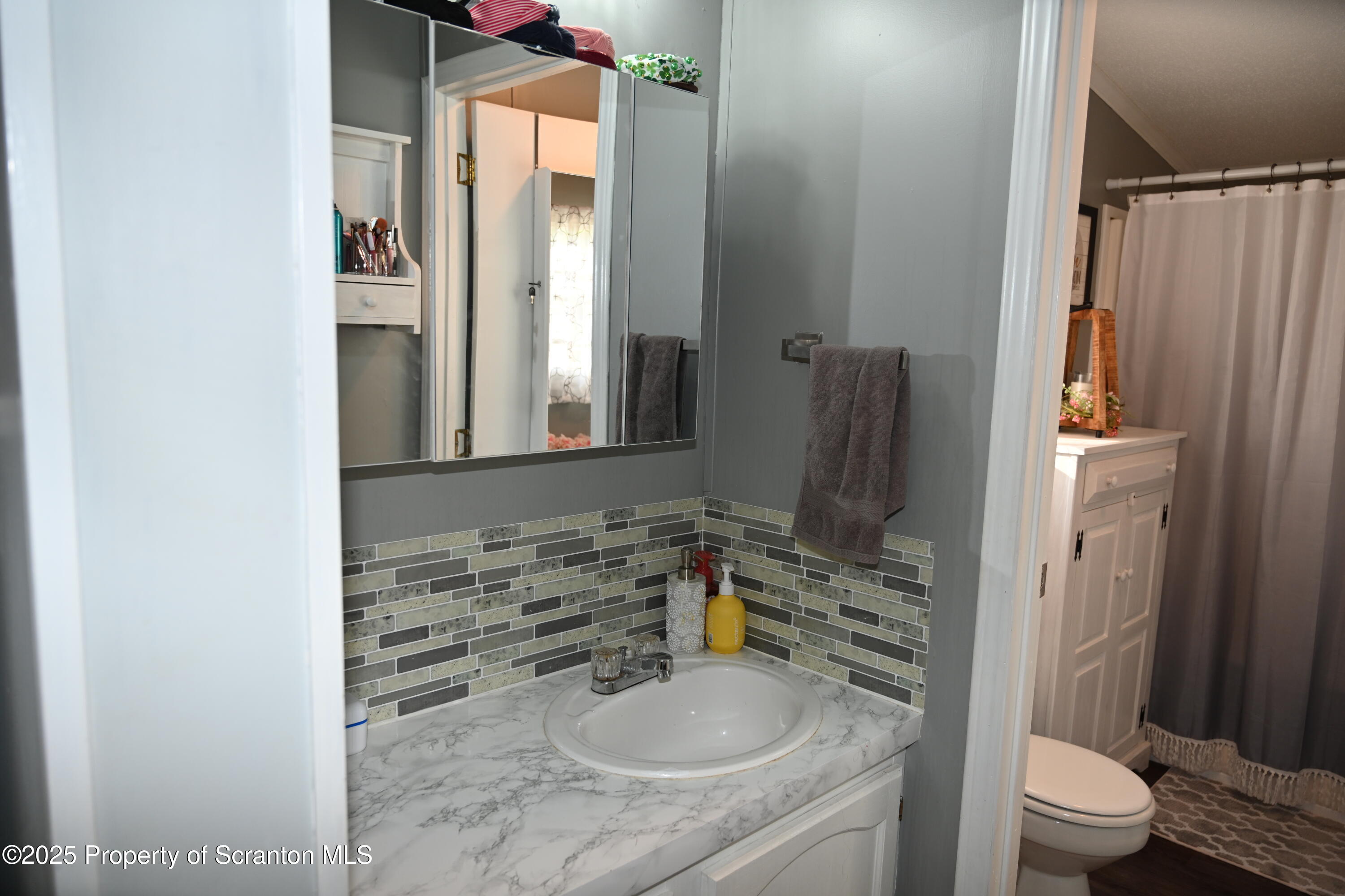 68 Spring Street Great Bend, PA 18821 - Photo 13 of 32 a bathroom with a granite countertop sink toilet and shower