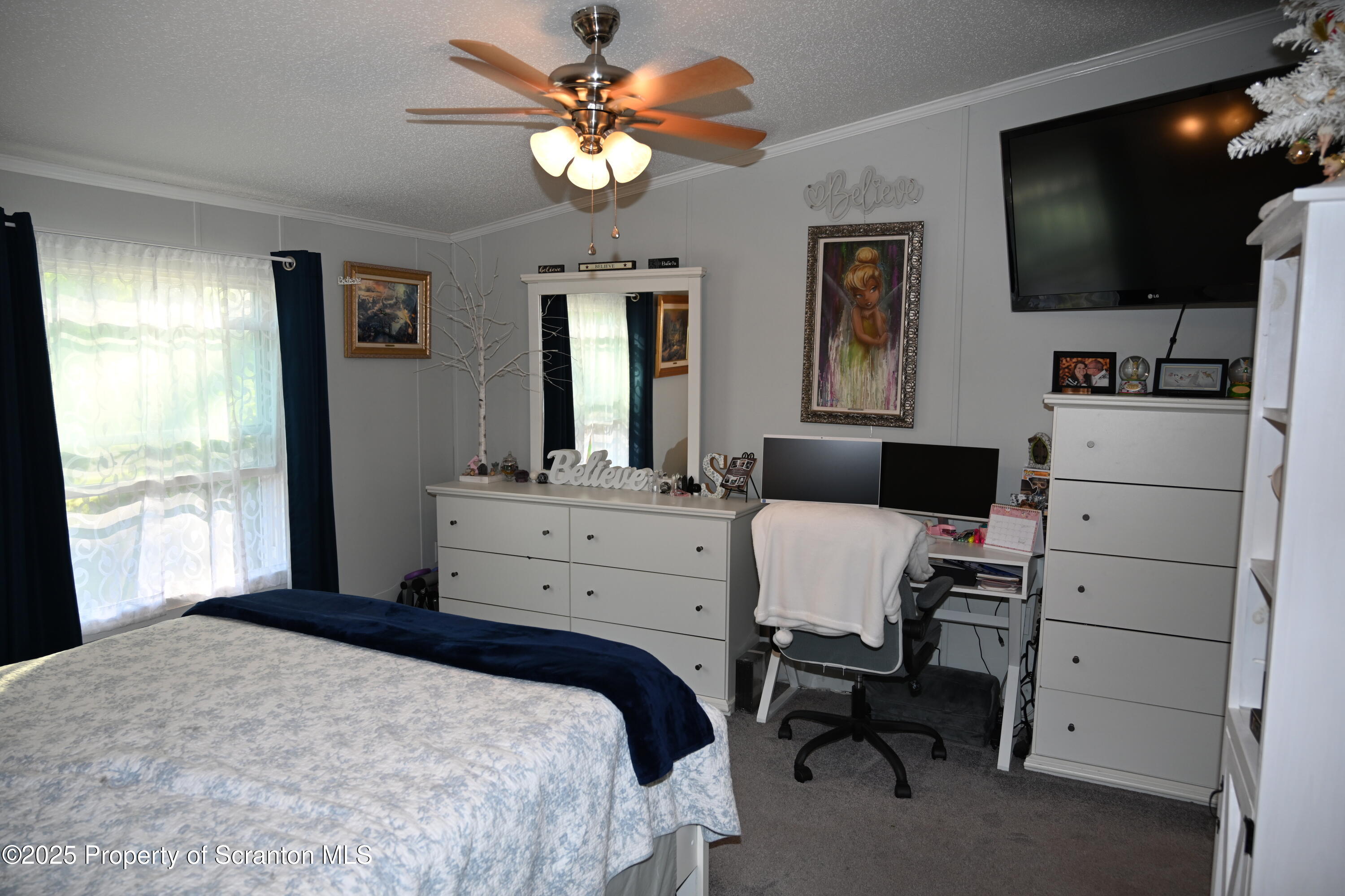 68 Spring Street Great Bend, PA 18821 - Photo 16 of 32 a bedroom with a bed and a flat screen tv