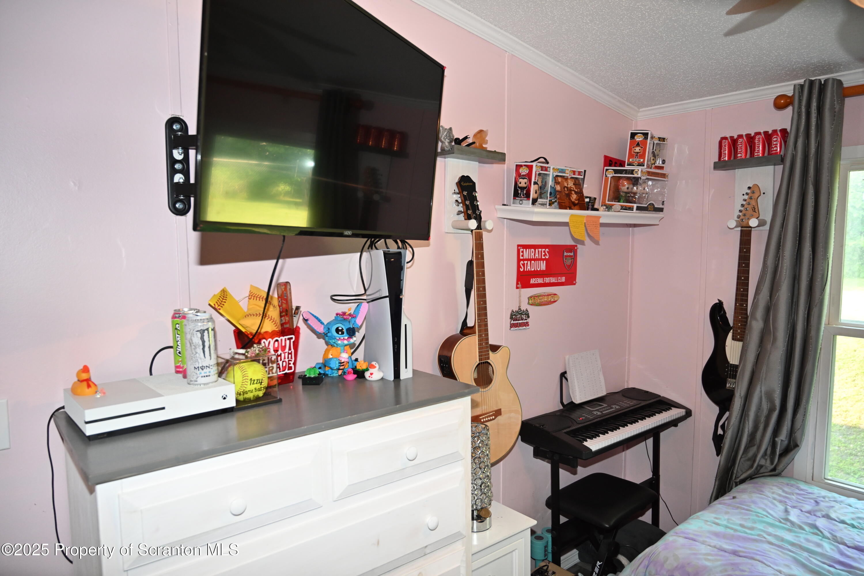 68 Spring Street Great Bend, PA 18821 - Photo 18 of 32 a living room with furniture and a flat screen tv