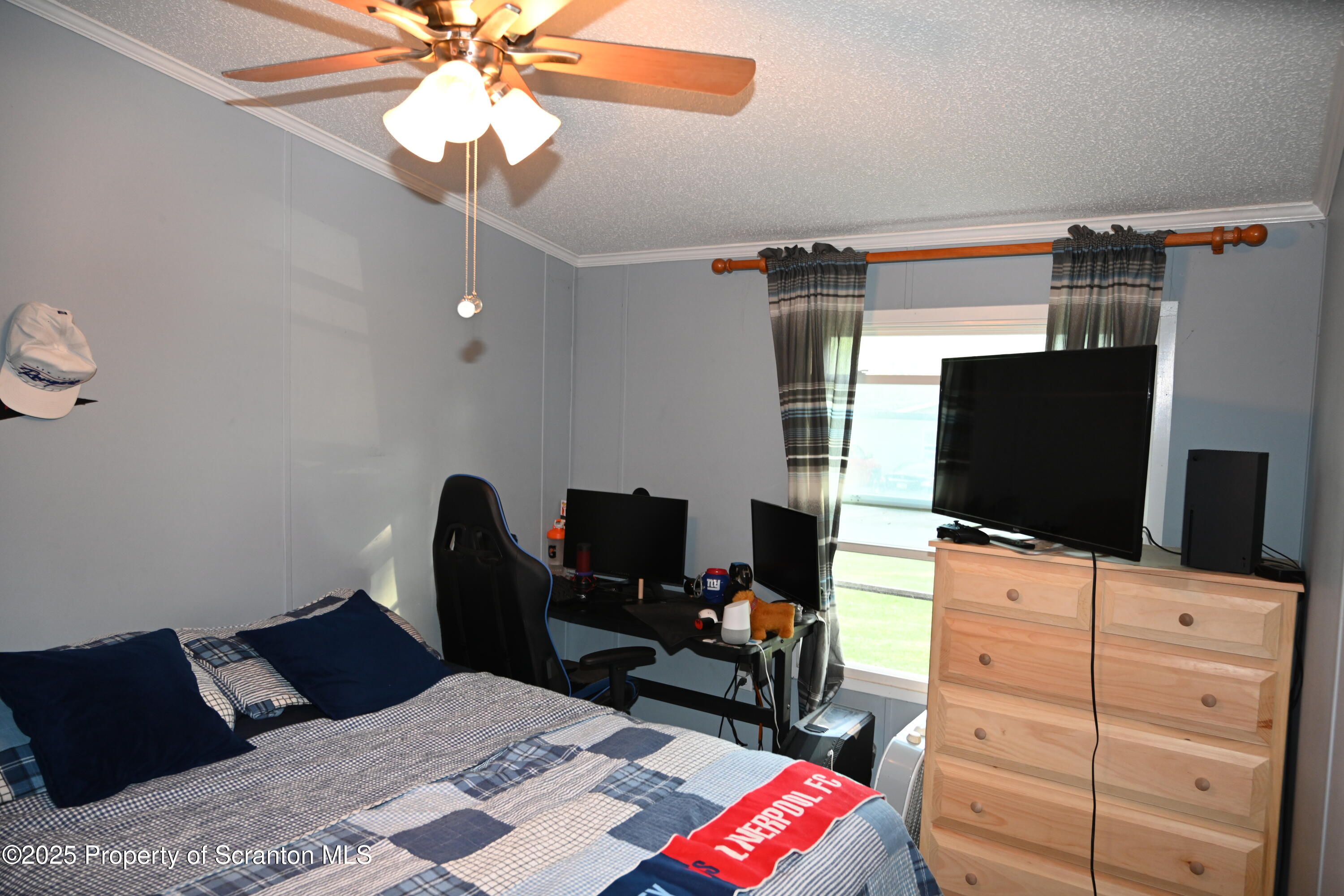 68 Spring Street Great Bend, PA 18821 - Photo 19 of 32 a bedroom with a bed and flat screen tv